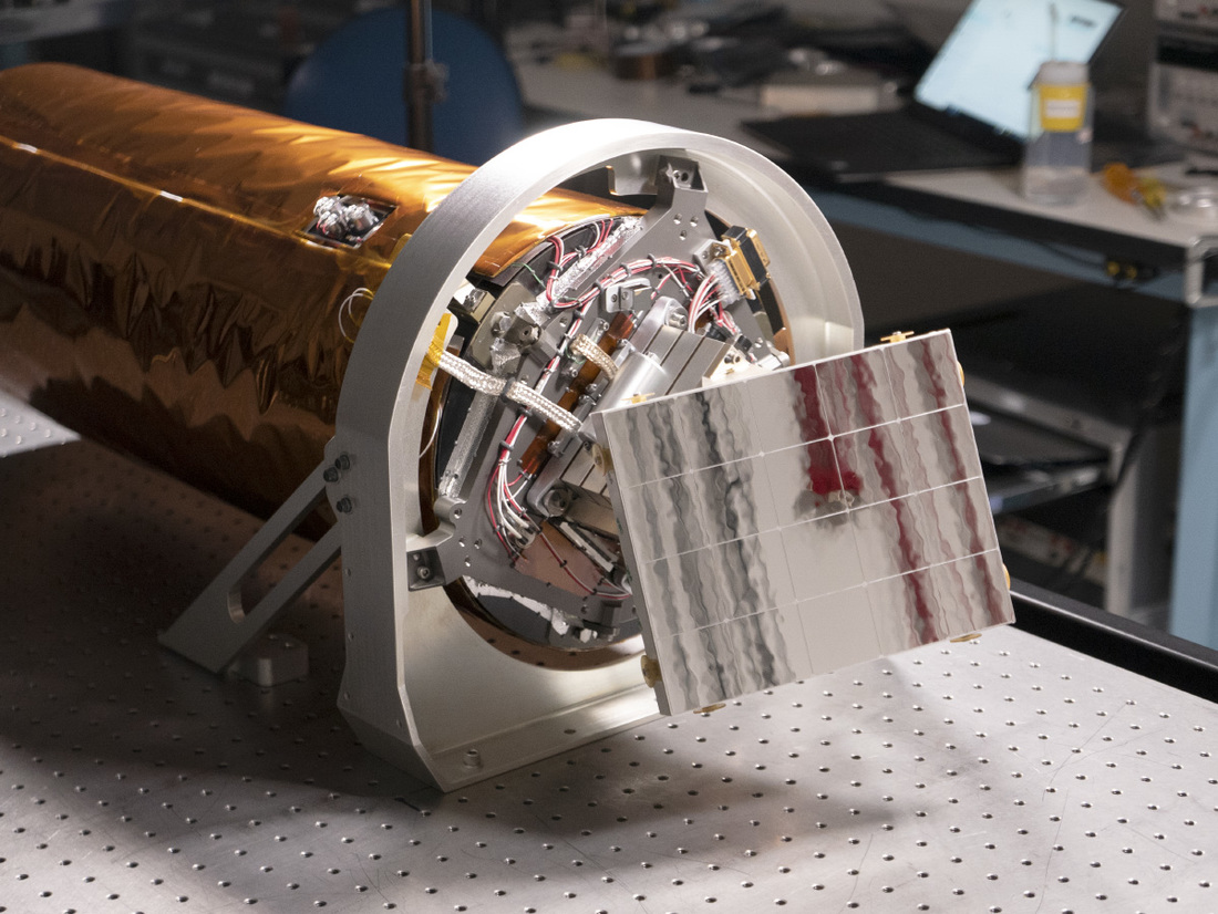 Close up photo of the focal plane electronics and radiator (checkered mirror) that will keep the detector cool while in lunar orbit.