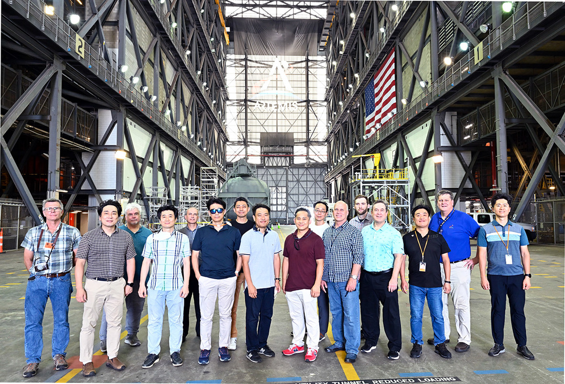 Image of KARI team members, ShadowCam members, Johnson Space Center and NASA Headquarters members at Kennedy Space Center as KPLO prepares for integration.
